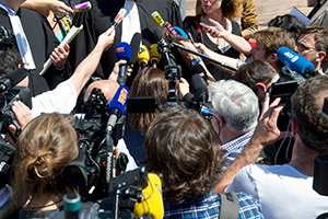 Journalists holding microphones